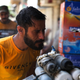An Iraqi man uses a curbside shower to cool off during a heat wave in the capital Baghdad on June 14, 2019
